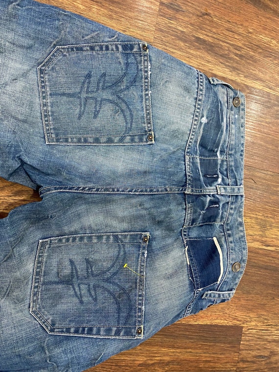 Distressed designer deals jeans