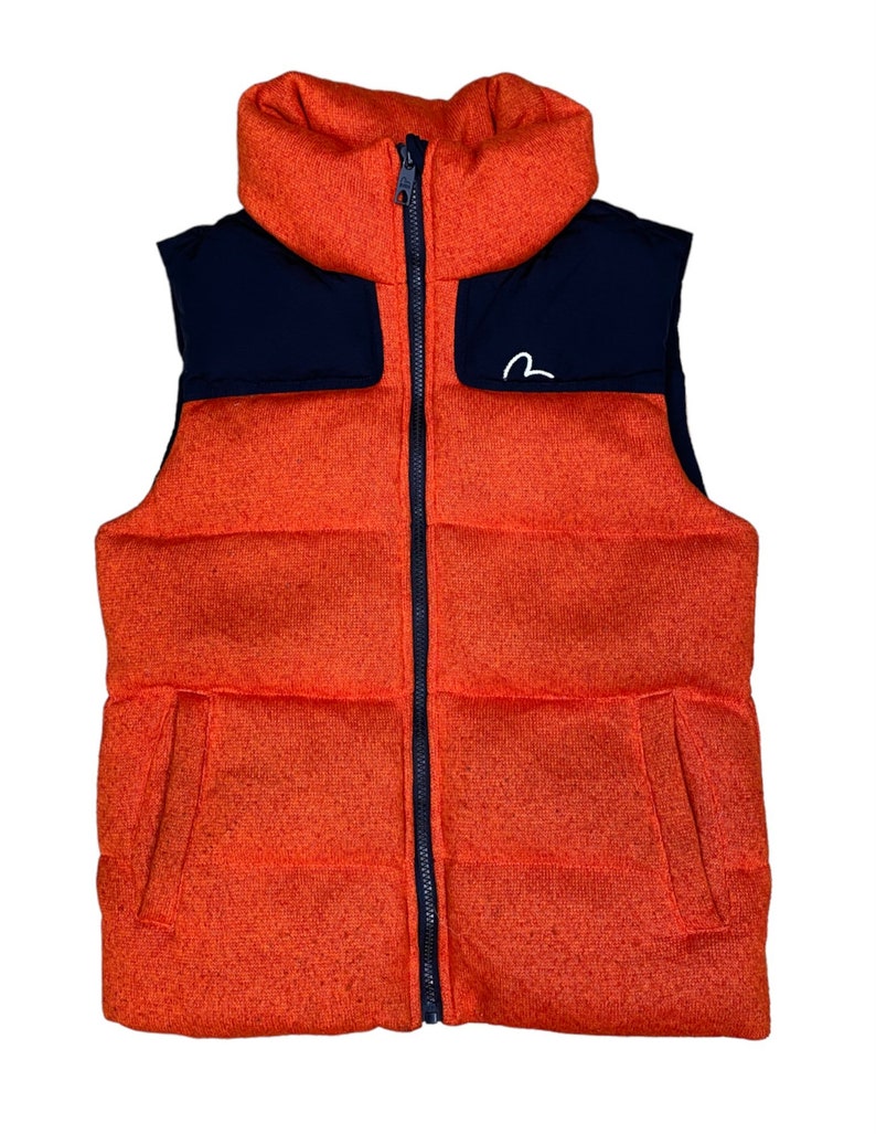 May include: Orange and navy blue puffer vest with a zipper closure and a small white logo on the chest.