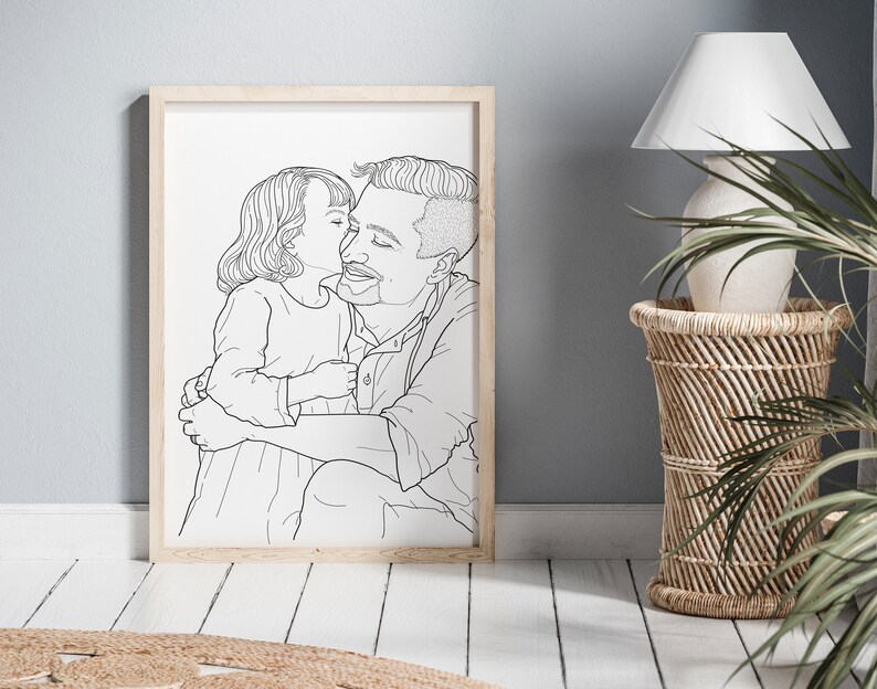 May include: A black and white line drawing of a father and daughter hugging. The daughter is kissing the father on the cheek. The drawing is framed in a light wood frame.
