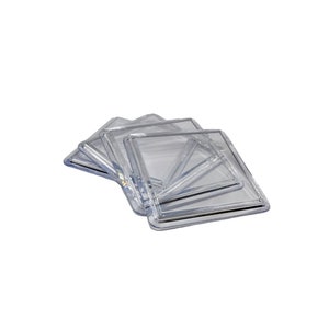 May include: Four clear plastic square coasters stacked on top of each other.