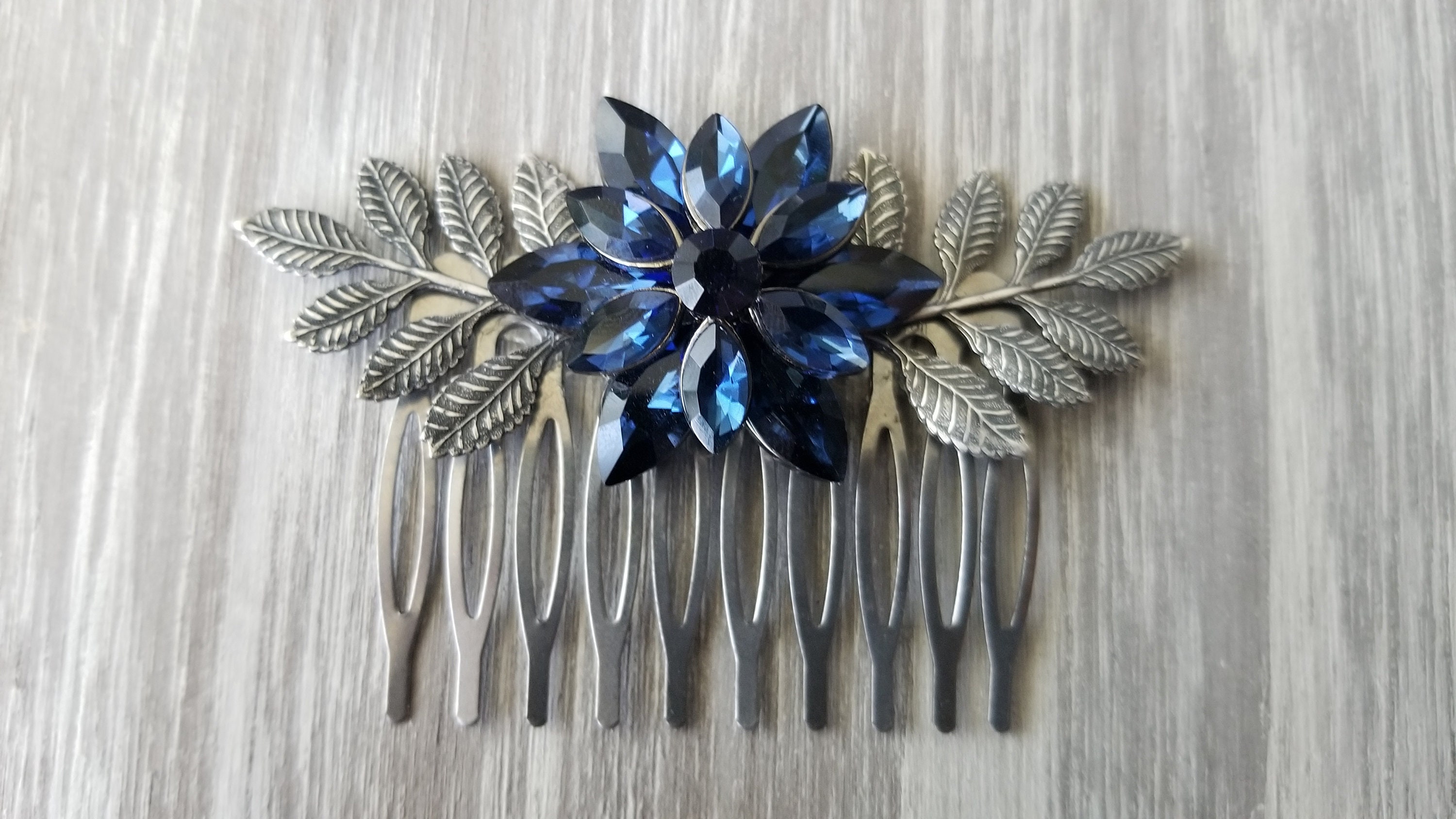 Materials for Creating Jewelry. Navy Blue Rhinestones, Hair Combs, Metal  Flowers on a Paper Background Stock Photo - Image of design, creativity:  194059696