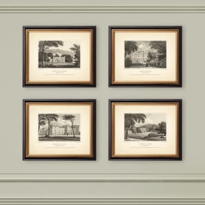 May include: Four framed black and gold prints featuring black and white landscape illustrations of stately homes. Each print has a cream-colored background and is labeled with the name of the location. The prints are displayed on a light green wall.