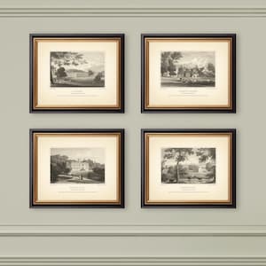 May include: Four framed black and gold prints of landscape scenes. Each print features a detailed black and white illustration of a building or estate, with text at the bottom. The frames are square and mounted on a light gray wall.