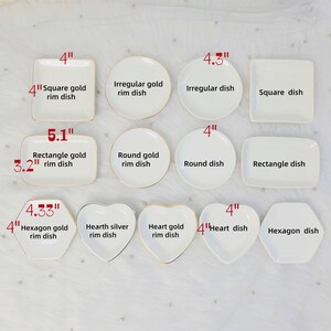 May include: A collection of white ceramic dishes in various shapes, including square, round, rectangular, heart, and hexagon. Some dishes have gold rims. Sizes are indicated in inches, ranging from 3.2" to 5.1" in length or diameter.
