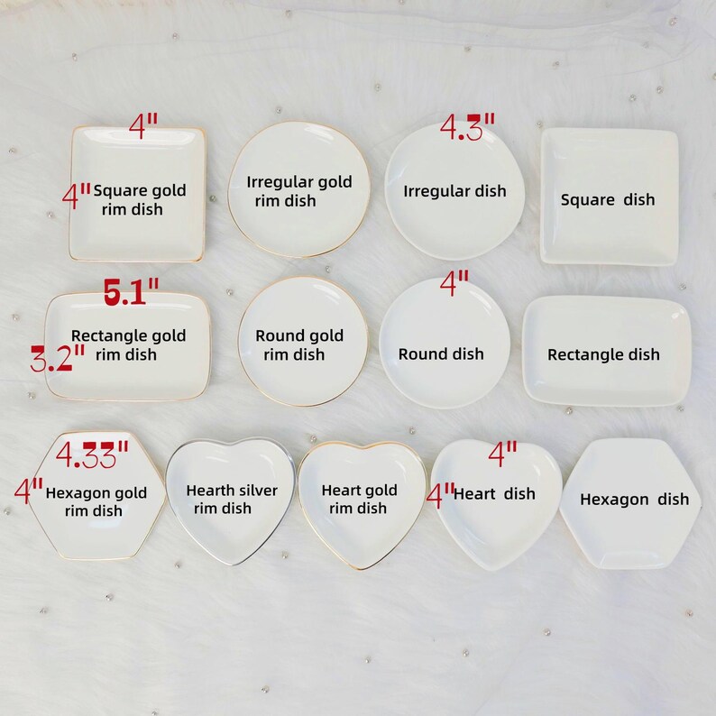 May include: A collection of white ceramic dishes in various shapes, including square, round, rectangular, heart, and hexagon. Some dishes have gold rims. Sizes are indicated in inches, ranging from 3.2" to 5.1" in length or diameter.
