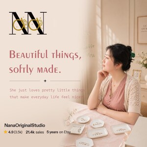 May include: A collection of small, white, rectangular and hexagonal ceramic trinket dishes with gold-colored text, arranged on a table. The text on the image reads: NN, Beautiful things, softly made, and NanaOriginalStudio.