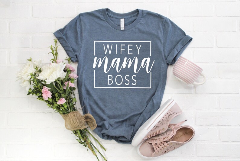 May include: A blue t-shirt with the text "WIFEY mama BOSS" in a white box.