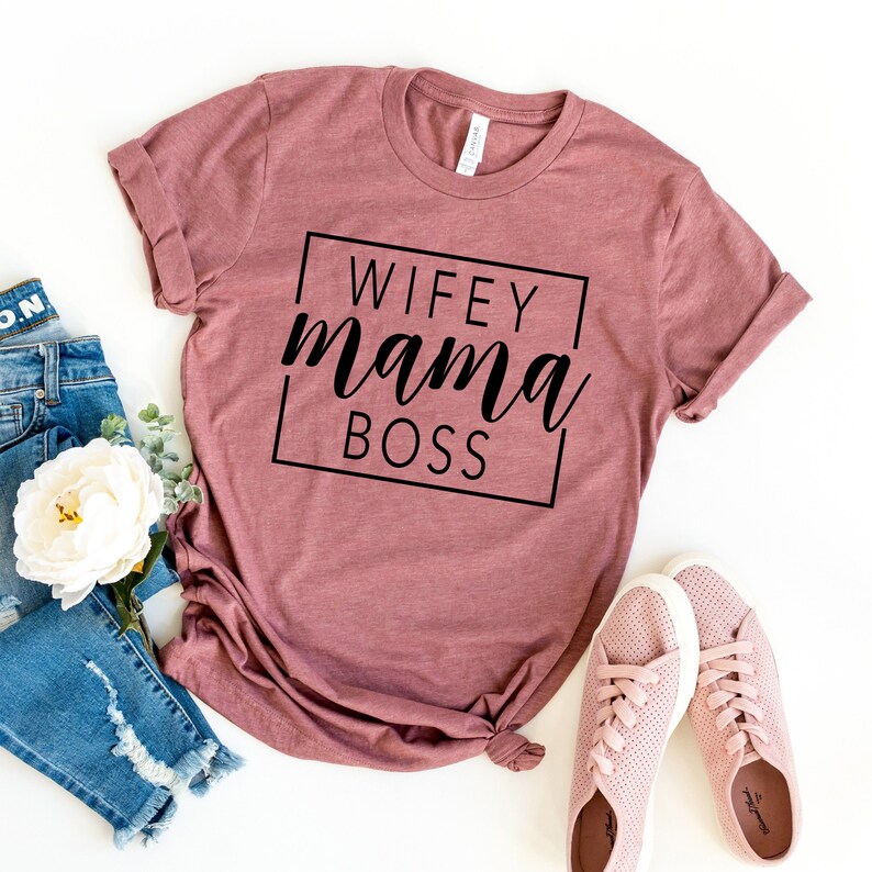 May include: A mauve t-shirt with the text "WIFEY mama BOSS" in a black box.