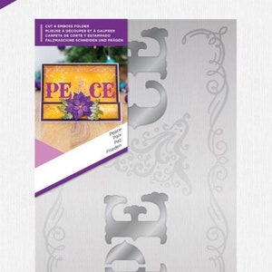Pode incluir: Um estêncil de corte de metal prateado com a palavra "Peace" em uma fonte decorativa. O estêncil é projetado para ser usado com uma máquina de corte para criar cartões, páginas de scrapbook e outras artesanato de papel.