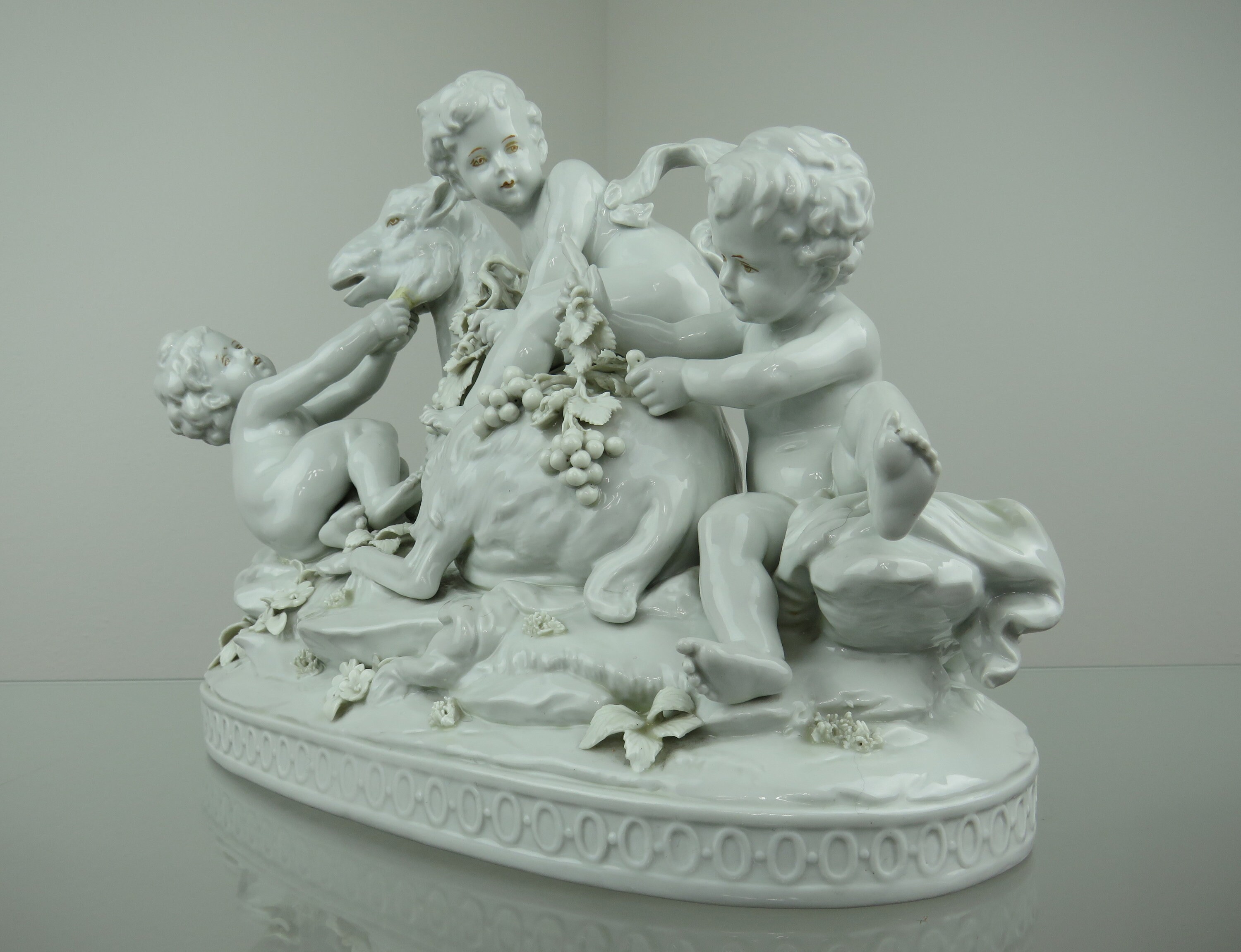 Magnificent porcelain "Putti Bacchus playing and riding a goat" -- AEN Aelteste Porzellanmanufaktur Volkstedt 1915 - 1936 --