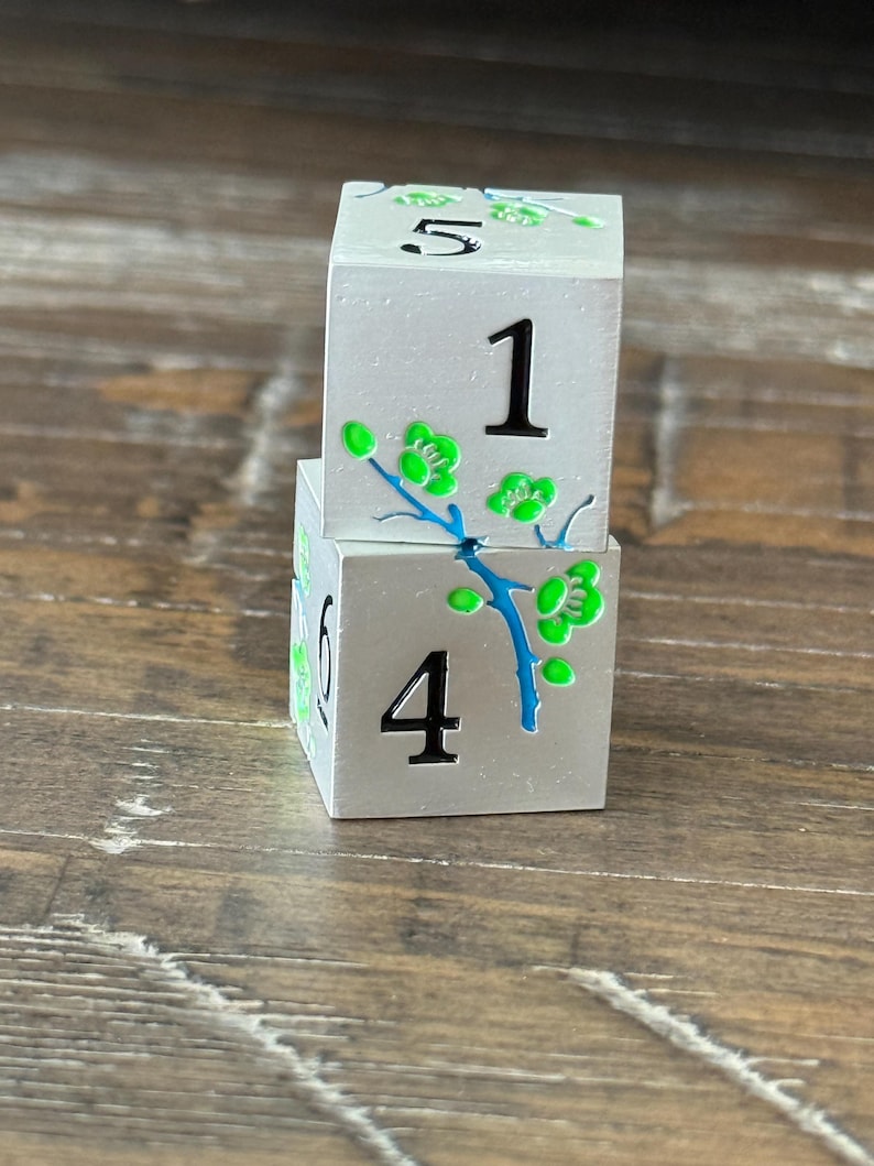 Mahjong pair of Flower Dice in organza bag. silver and green