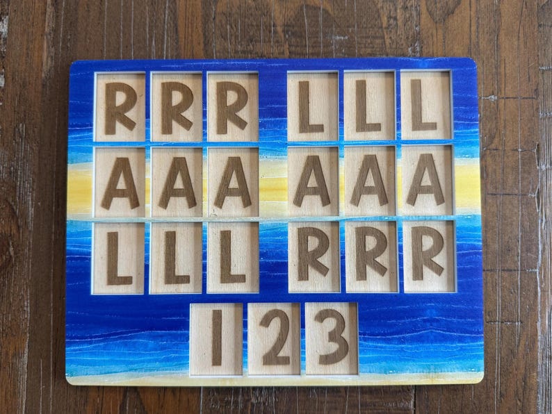 May include: A rectangular wooden puzzle board featuring a blue and yellow painted gradient background. The board contains multiple square cutouts, each holding a wooden tile engraved with the letters R, L, A, or the numbers 1, 2, and 3.
