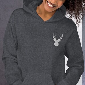 May include: A dark gray hooded sweatshirt with a white embroidered deer head design on the front.