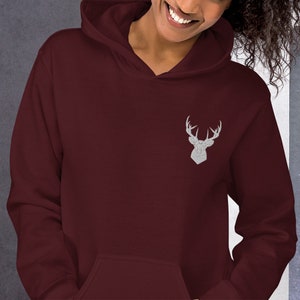 May include: A maroon hoodie with a white embroidered deer head design on the front.