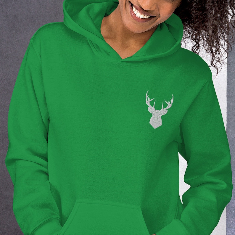May include: A green hooded sweatshirt with a white embroidered deer head on the left chest.