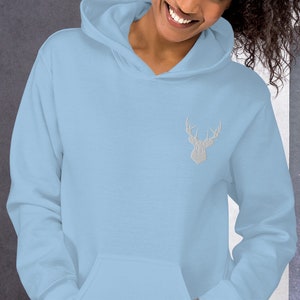 May include: A light blue hoodie with a white embroidered deer head on the front.
