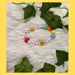 Happy Days mushroom, happy face, and heart charm bracelet