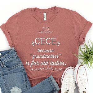 May include: A mauve t-shirt with white text that reads "CECE because "grandmother" is for old ladies."
