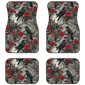 May include: Set of four car floor mats with a gothic design featuring black crows perched on branches with red roses. The background is a gray and white watercolor wash.