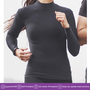May include: A black mock neck long-sleeve shirt. The shirt is fitted and has a smooth, athletic look.
