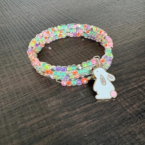 May include: A set of three ceramic mugs with a speckled, matte finish. The mugs are in shades of cream, light brown, and dark brown. Each mug has a simple, minimalist design, perfect for coffee or tea.