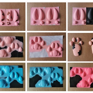 May include: Nine different silicone molds for making various shapes, including paw prints, hooves, and raindrops. The molds are shown in various stages of being painted pink and blue.
