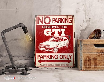 May include: Red and white metal sign with the text "NO PARKING RESERVED FOR GTI PARKING ONLY ALL OTHER VEHICLES WILL BE TOWED AWAY". A white Volkswagen GTI is pictured on the sign.