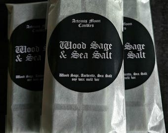 May include: Three wax melt bars in clear packaging. Each bar has a black circular label with white text that reads "Wood Sage & Sea Salt" and "Artemis Moon Candles". The packaging is sealed.