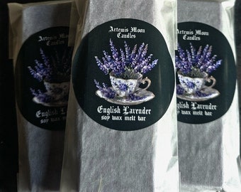 May include: Three packages of soy wax melt bars with a lavender scent. Each package features a black and white label with a teacup filled with lavender flowers and the text "Artemis Moon Candles" and "English Lavender soy wax melt bar".
