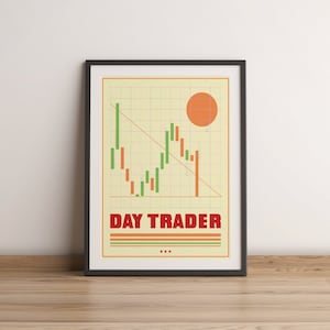 May include: A framed poster with a retro-style graphic of a stock market chart with green and orange bars, a red diagonal line, and a large orange circle. The text "DAY TRADER" is in red letters with three green stripes below it.