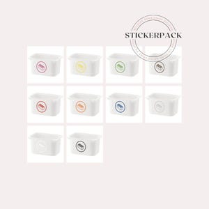 May include: A set of 10 white plastic storage bins with colorful labels. Each bin has a different colored label with a picture of a Lego brick. The labels are red, orange, yellow, green, blue, purple, pink, brown, black, and white.