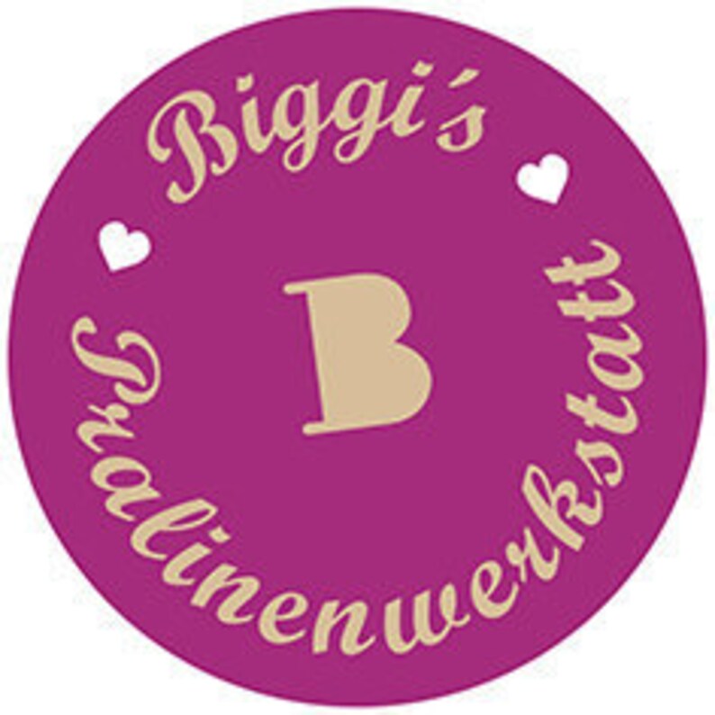 May include: A circular, magenta-colored logo with the text "Biggi's" in a cursive font at the top, and "Textilienwerkstatt" in a similar font around the bottom. A large, tan letter "B" is in the center, with two small white hearts on either side of "Biggi's".