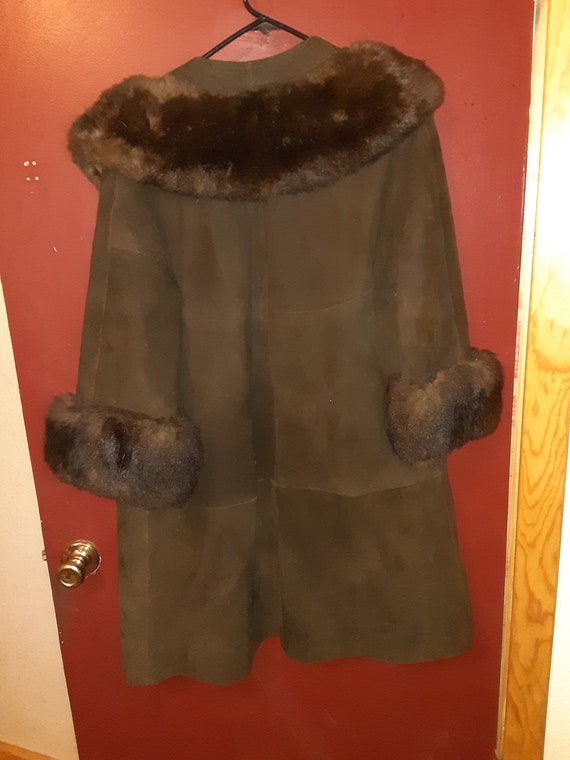 Leather coat with mink fur