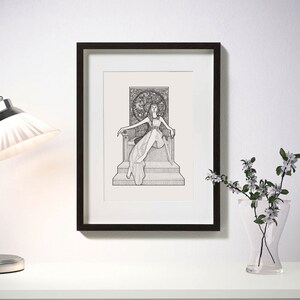 May include: Black framed art print featuring a detailed pen and ink illustration of a figure seated on a throne. The artwork depicts a person in a flowing gown, holding a sword, with a decorative backdrop. The print is displayed on a white wall.