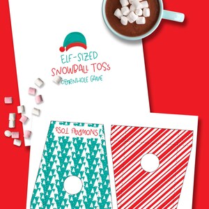 May include: Printable Elf-Sized Snowball Toss Cornhole Game. Two game boards with a Christmas tree and candy cane design. The game boards are ready to be cut out and assembled.