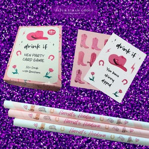 May include: Pink and white box with the text "drink if" and "Hen Party Card Game" on it. The box contains 32 cards with questions. There are three pink and white striped paper straws with the text "Harriet's Hoedown" on them.
