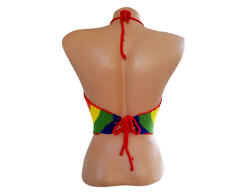 May include: A rainbow crochet halter top with red ties in the back.