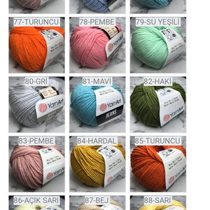 May include: A collection of 91 yarn balls in various colors, including beige, pink, blue, green, orange, red, yellow, and purple. Each ball is labeled with a number and a color name in Turkish.