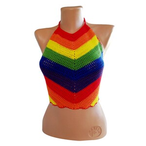 May include: A rainbow crochet halter top with a chevron pattern. The top is made of a soft, lightweight yarn and is perfect for summer.
