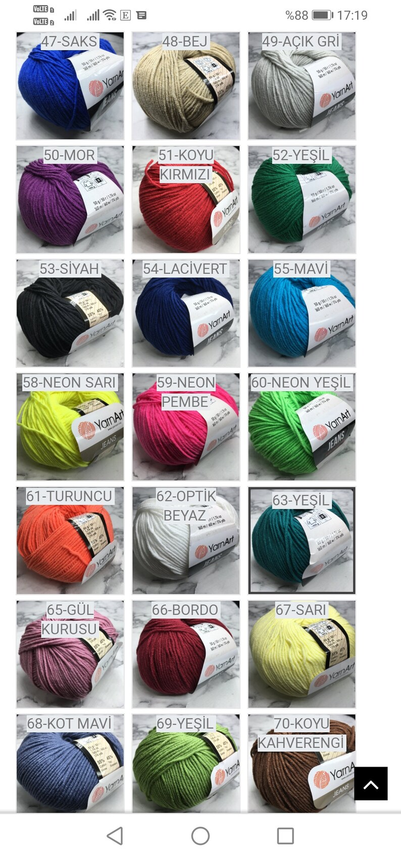 May include: A collection of yarn balls in various colours, including blue, beige, purple, red, black, green, yellow, orange, white, pink, teal, brown, and grey. Each ball has a label with a number and a colour name in Turkish.