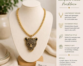 May include: A gold-toned beaded necklace featuring a large leopard head pendant with black and gold detailing. The necklace includes a lobster clasp closure. Text on the image reads: Leopard Head Necklace, Lightweight Design, Statement Piece, Versatile Style, Perfect Gift, Details: Length: Approx. 18-20 inches, Pendant: Approx. 2 inches, Gold plastic beads, Lobster clasp closure, Lightweight & comfortable, Handmade with care.