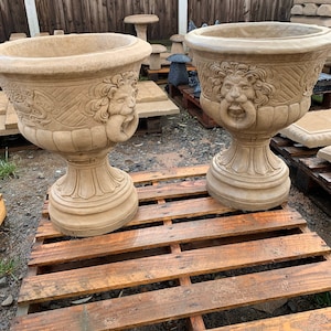 Pair of cast stone lion planters