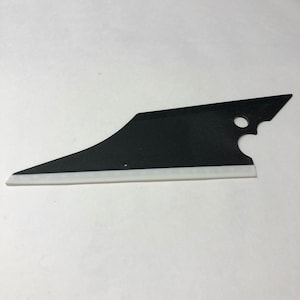 May include: A black squeegee with a white edge. The squeegee has a curved handle and a straight blade.