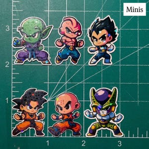 May include: A collection of six chibi-style stickers featuring characters from Dragon Ball Z. The stickers showcase characters like Piccolo, Vegeta, and Cell, each in dynamic poses. The word "Minis" is in the top right corner.
