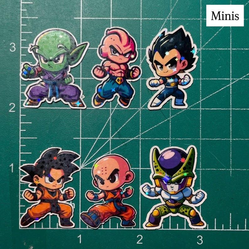 May include: A collection of six chibi-style stickers featuring characters from Dragon Ball Z. The stickers showcase characters like Piccolo, Vegeta, and Cell, each in dynamic poses. The word "Minis" is in the top right corner.