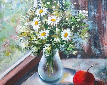 May include: An oil painting depicting a bouquet of white daisies with yellow centers in a clear glass vase, positioned next to a single red apple on a windowsill. The scene includes a view of green foliage outside and a signature by Tanya Hubo 2025.