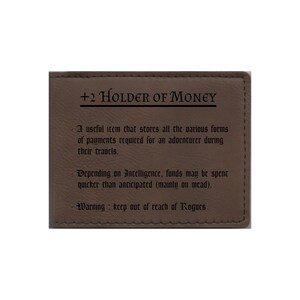 May include: A brown leather wallet with the text "+2 Holder of Money" and a description of its use in a fantasy game setting.