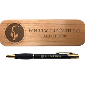 May include: A wooden nameplate with the text "Fenrage the Natural Half Elf Druid" and a symbol of a staff with leaves. A black pen with gold accents and the text "Roll for Initiative" is included.