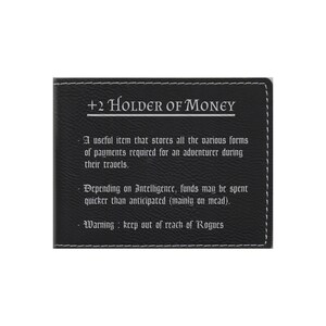 May include: A black leather wallet with the text " +2 HOLDER OF MONEY" and a description of its use in a fantasy game setting.