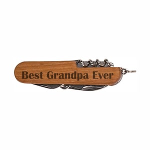 May include: A wooden handled pocket knife with a variety of tools, including a corkscrew, blade, and file. The handle is engraved with the text "Best Grandpa Ever".